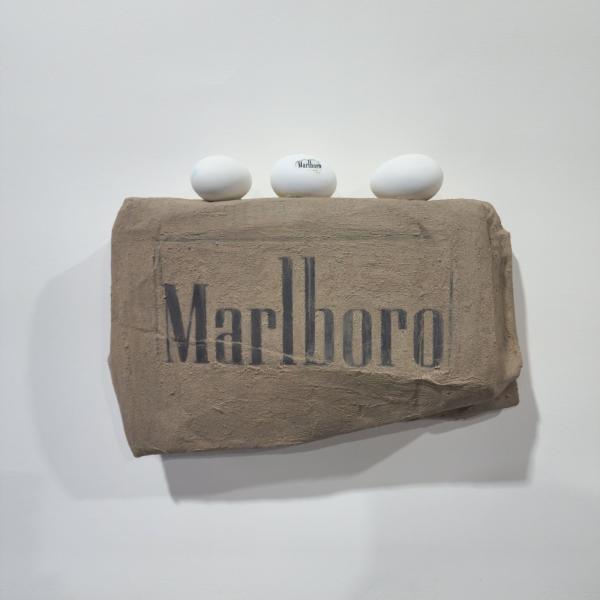 Marlboro, 2021, used coal briquette, eggshell, thrown away items, mixed media, 39 x 29 x 8.5 cm